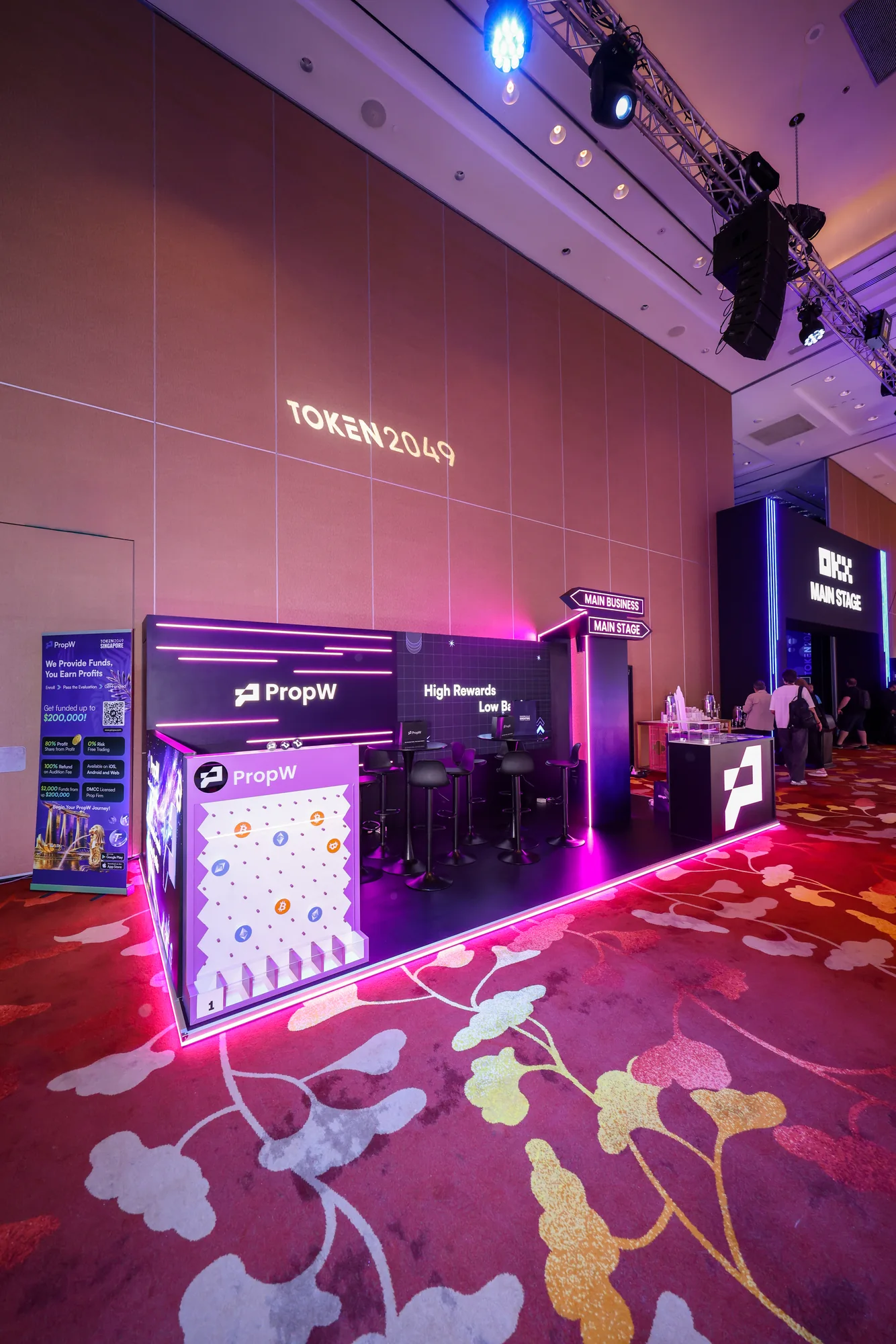 The booth from the corner, with the plinko wall and lounge behind