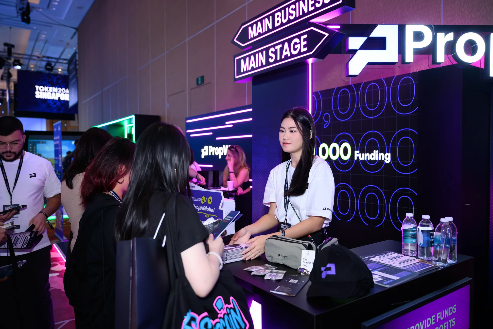 PropW staff talking with visitors at the counter