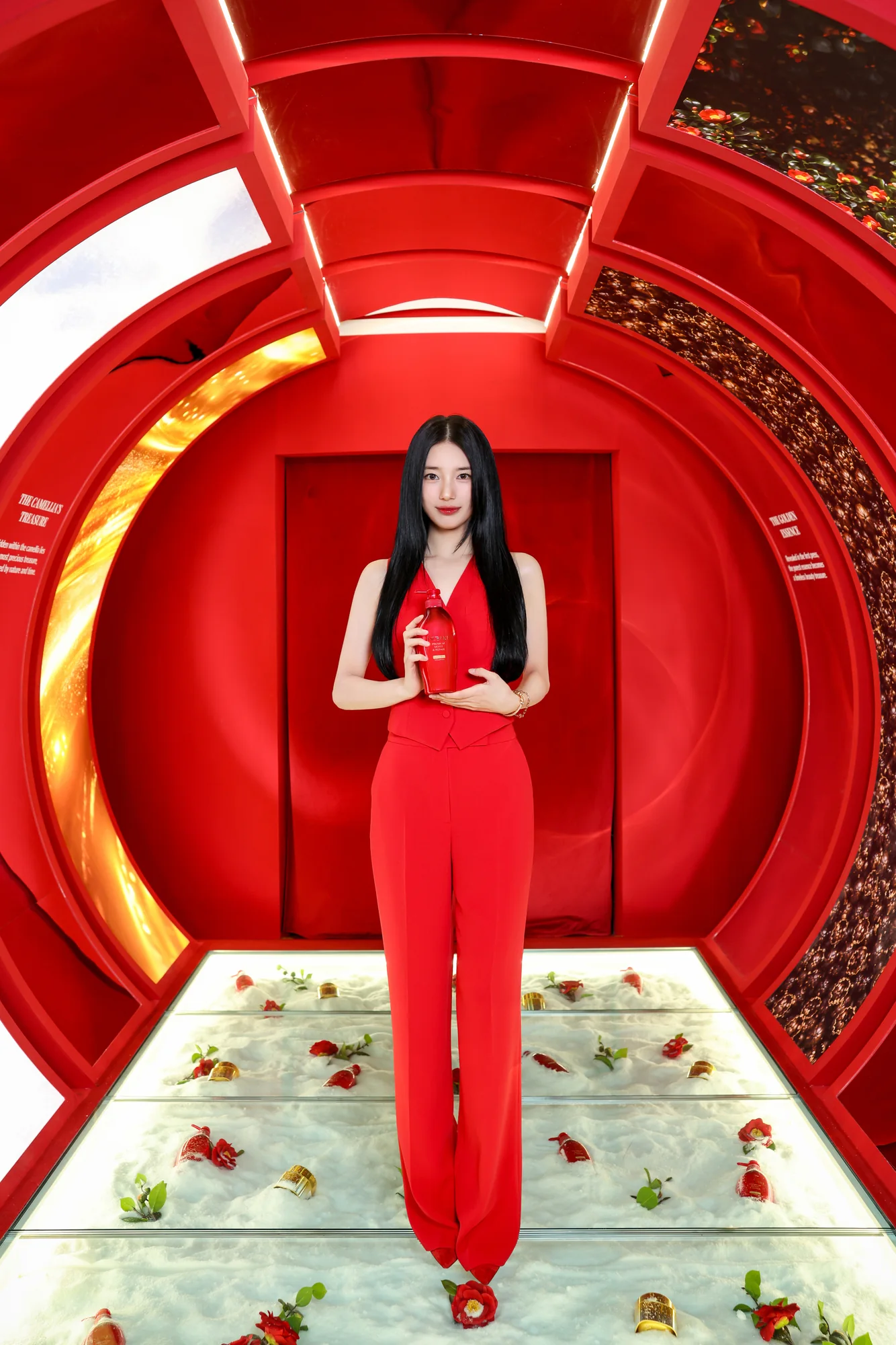Suzy Bae standing in the red tunnel walk